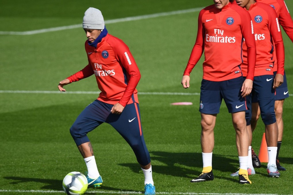 Paris Saint-Germain's Brazilian forward Neymar (L) controls the ball during a training session. Neymar will miss the game on Saturday because of injury. Photo: AFP