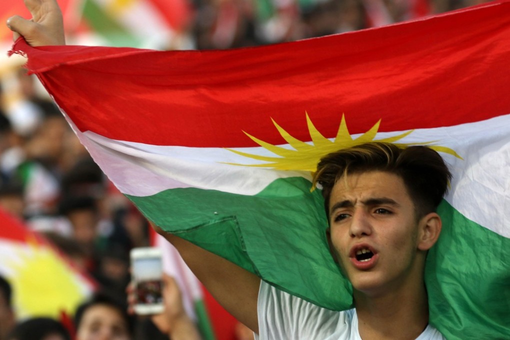 Iraqi Kurds fly Kurdish flags at a mass gathering to celebrate the independence referendum in Arbil, the capital of the autonomous Kurdish region of northern Iraq. The movement for the vote, which foreign powers want postponed, is being lead by Iraqi Kurdish head Massoud Barzani. Photo: AFP