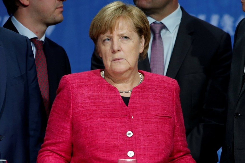 German Chancellor Angela Merkel, from the Christian Democratic Union Party, addresses crowds during her final rally in Munich on Friday, which was disrupted by protesters the hard right. Photo: Reuters