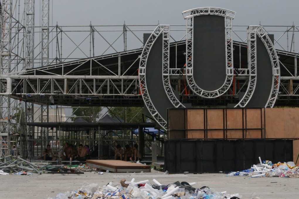 Workers clear the stage at Road to Ultra Hong Kong at West Kowloon Cultural District after a 27-year-old man fainted during the concert on September 16 and was pronounced dead in hospital about an hour later. Photo: David Wong