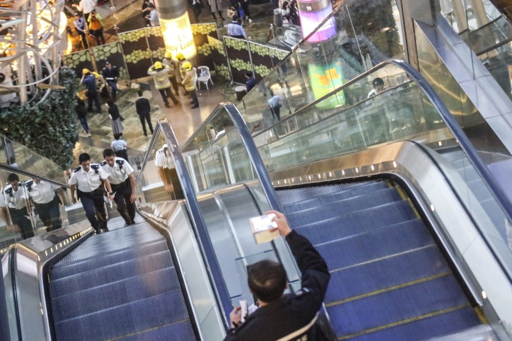 Police at the scene of the escalator accident in Langham Place, Mong Kok. Photo: Felix Wong