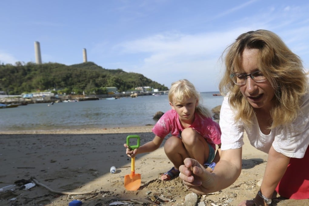 Eco warrior Jo Wilson (right) and her daughter Kate picking up rubbish from a beach on Lamma Island. Photo: Xiaomei Chen