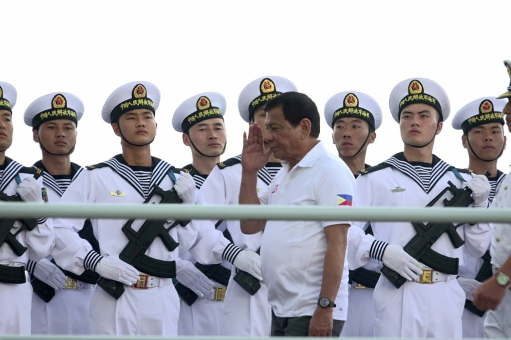 Filipino President Rodrigo Duterte salutes Chinese sailors during a goodwill visit earlier this year. Photo: EPA