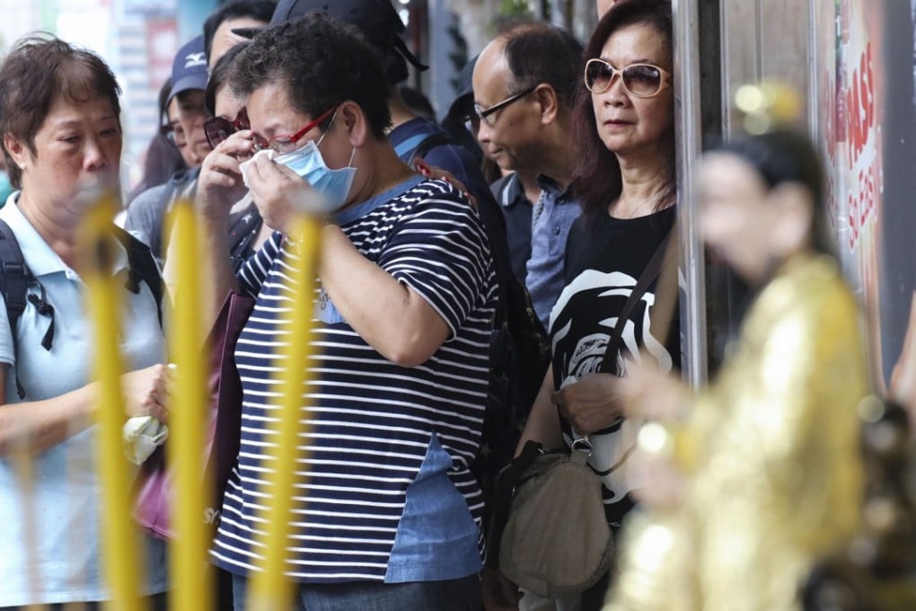 Relatives of victims involved in Friday’s bus crash attend a ritual ceremony on Yen Chow Street in Sham Shui Po. Photo: Felix Wong