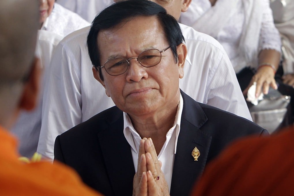 Leader of the Cambodia National Rescue Party Kem Sokha prays during a Buddhist ceremony. Photo: AP