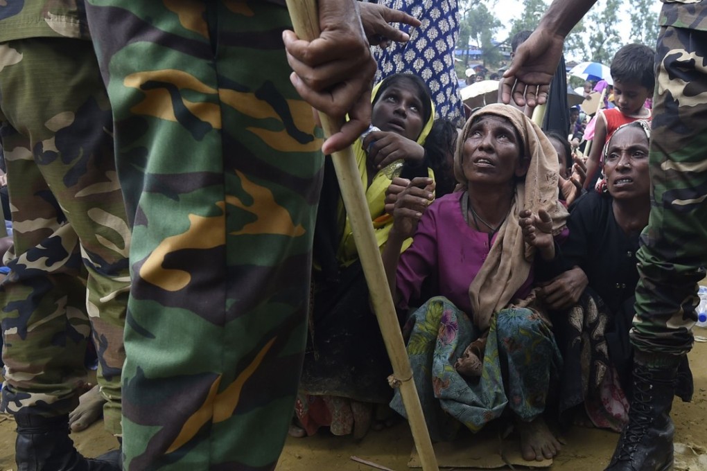 Rohingya refugees wait for food to be distributed by the Bangladesh army at the Balukhali refugee camp in Cox’s Bazar. With Bangladesh already hosting tens of thousands of Rohingya who have fled Myanmar over the years, this latest wave poses significant risks not only to Bangladesh, but to the region as a whole. Photo: AFP