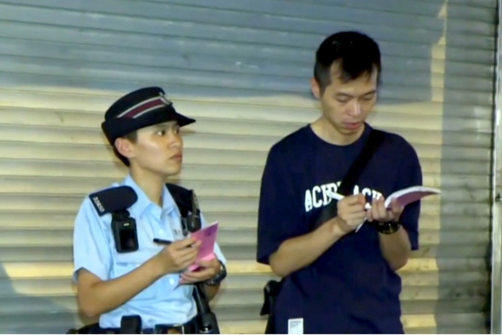 Two officers at the scene where a man had attempted to snatch a policeman’s gun. Photo: Handout
