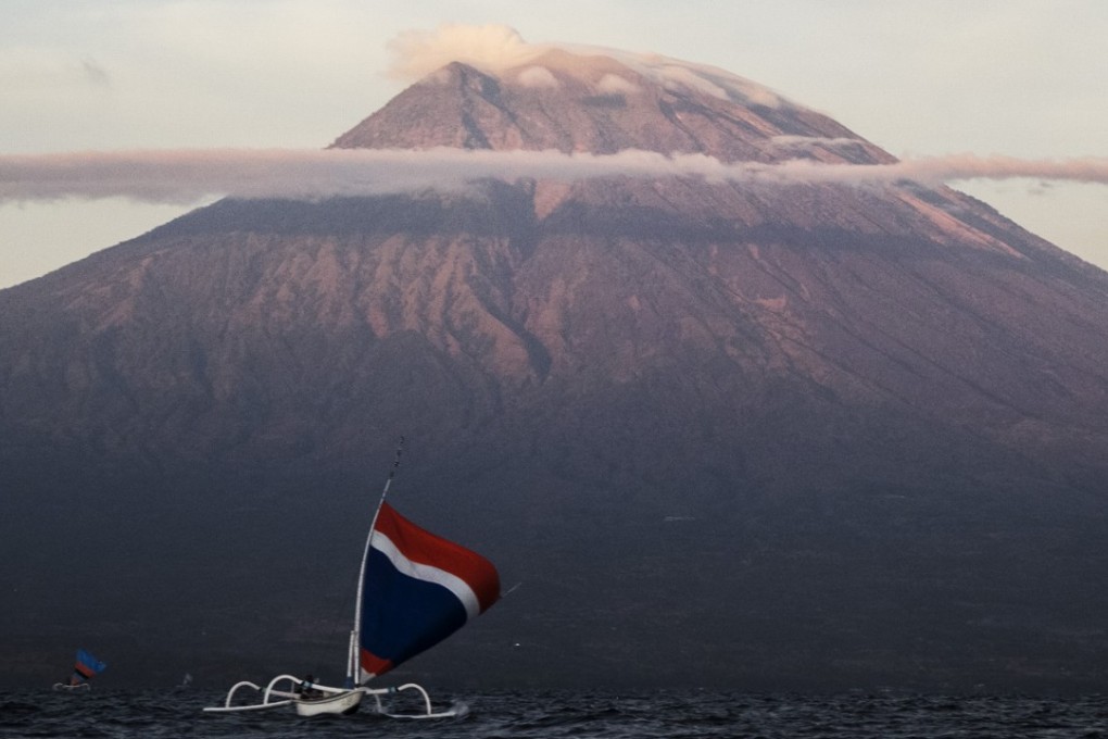 A fishing boat off the coast near Mount Agung. Photo: Xinhua