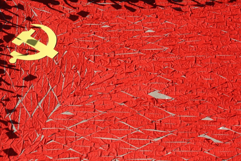A Communist Party flag – made of red scarves by students ahead of the party congress next month – is seen at a primary school in Shandong province. The party has vowed to protect the rights and interests of entrepreneurs. Photo: Reuters