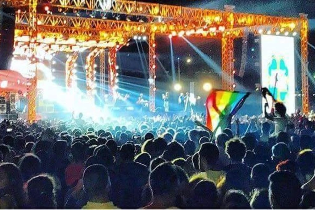 A rainbow flag is waved at a Mashrou’ Leila concert in Egypt. The lead singer of the popular Lebanese alternative rock band is gay. Photo: Twitter / @HithamAlkashif
