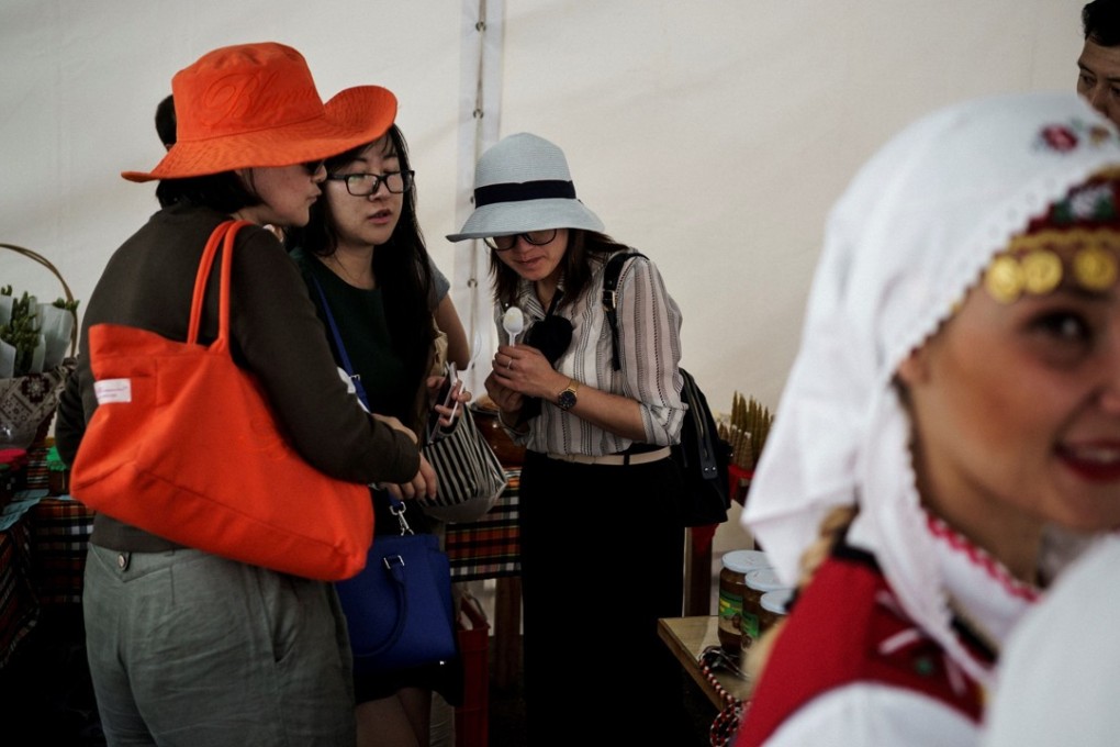 Chinese tourists and locals in traditional garb attend the third Chinese-Bulgarian yogurt festival in the village of Momchilovtsi on September 8. Photo: AFP
