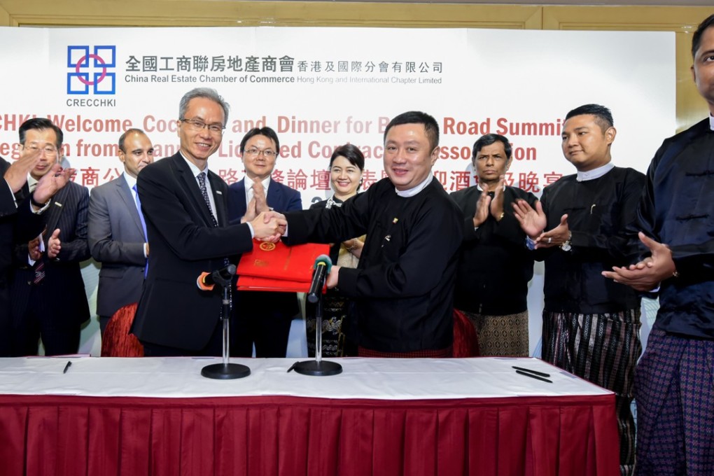 CRECCHKI and Myanmar Licensed Contractors Association delegates show their delight after signing the memorandum of understanding.