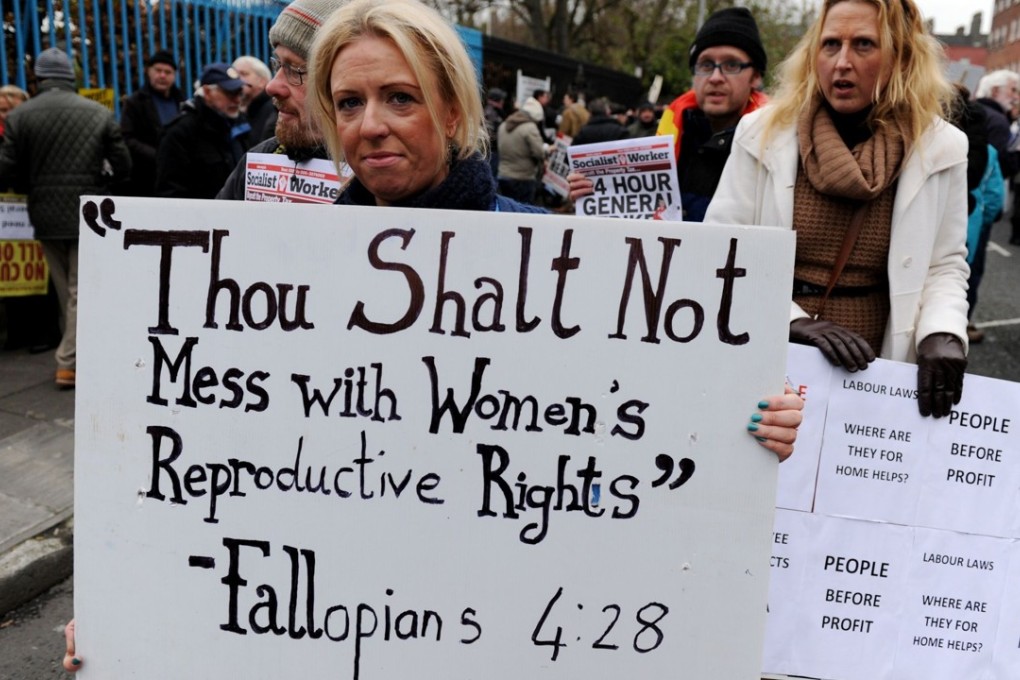 A file photo taken on November 24, 2012, shows a protestor with a placard against Ireland's anti-abortion laws during a march in Dublin. Photo: AFP