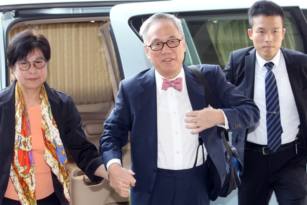 Former Hong Kong Chief Executive Donald Tsang Yam-kuen (centre) and his wife Selina Tsang Pou Siu-mei arriving at the High Court. Photo: David Wong