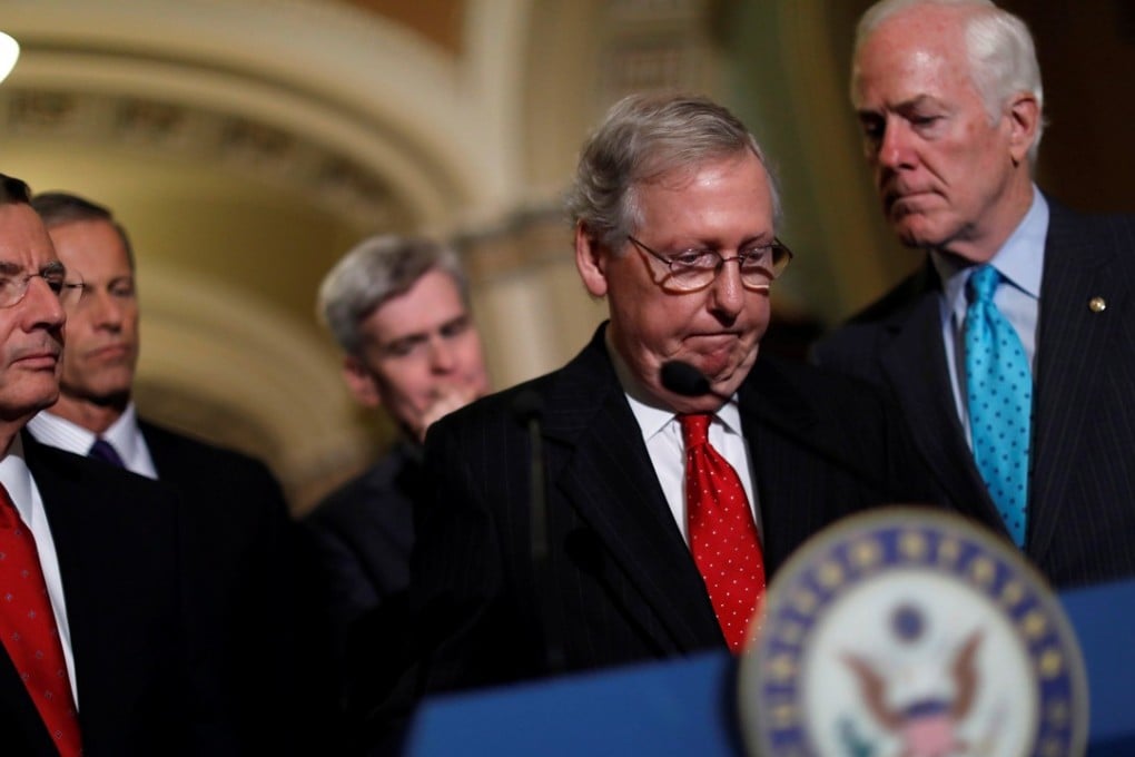 US Senate Majority Leader Mitch McConnell, accompanied by (from left) fellow Republican senators Lindsey Graham, John Barrasso, John Thune, Bill Cassidy and John Cornyn, speaks on the withdrawal of the party’s latest bid to repeal ObamaCare. Photo: Reuters