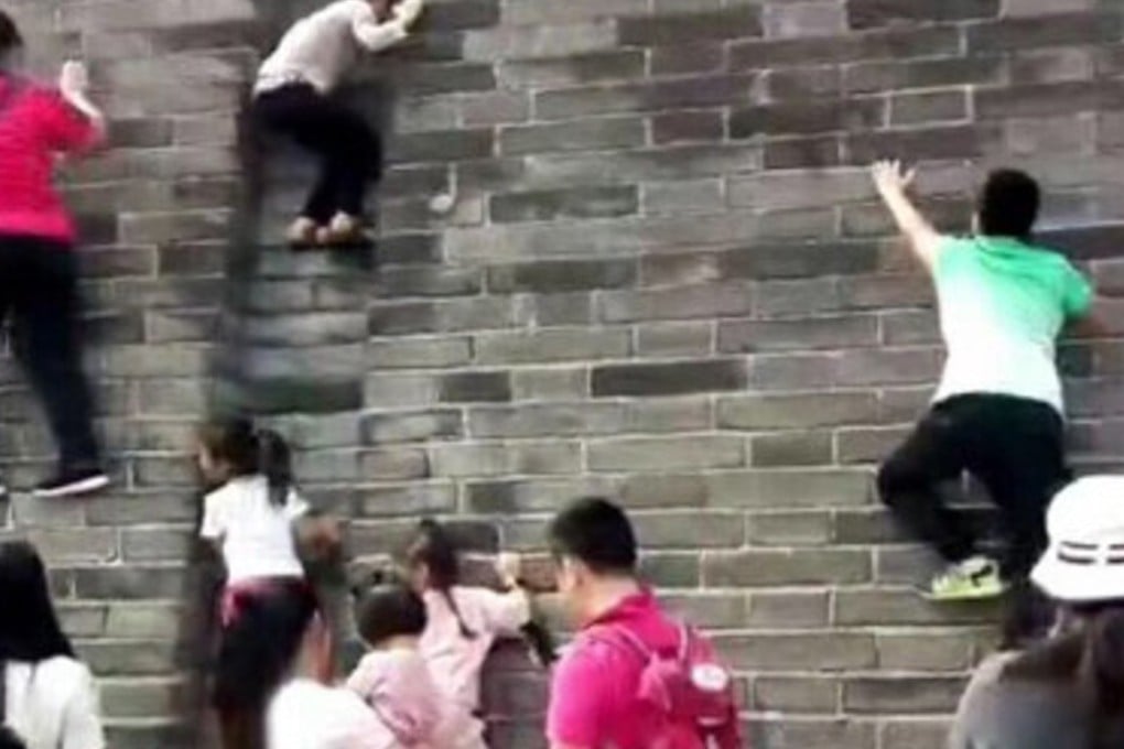 Pictures circulating online show adults and children climbing the Zhengding city wall. Photo: Handout