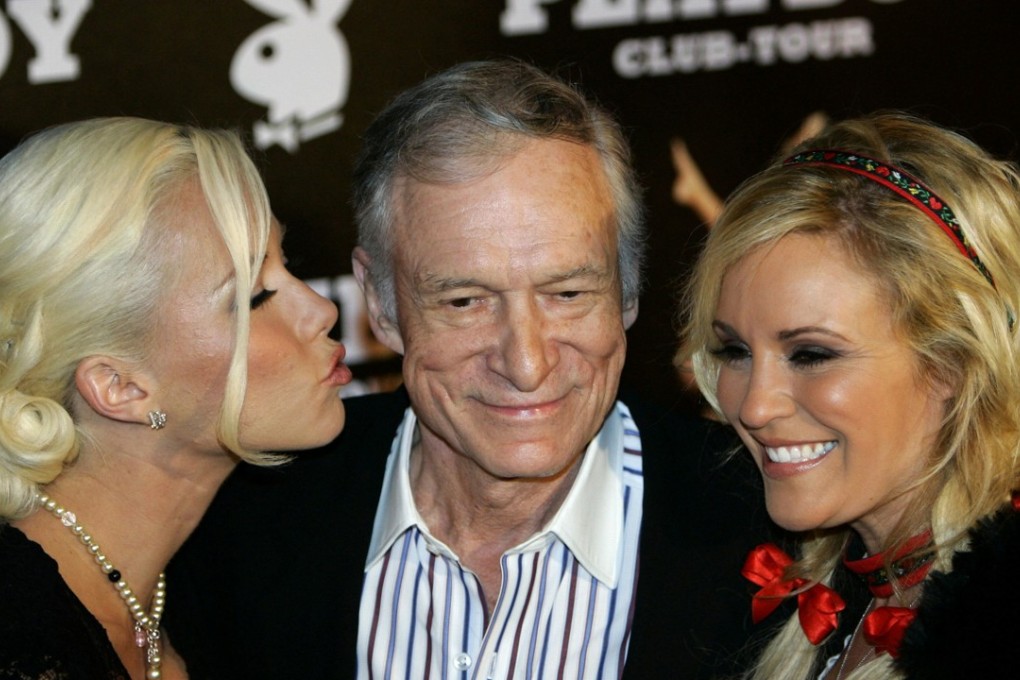 Playboy magazine founder Hugh Hefner arrives with girlfriends Kendra Wilkinson (left) and Bridget Marquardt for his 80th birthday party in Munich's famous club P1 in 2006. Photo: Reuters