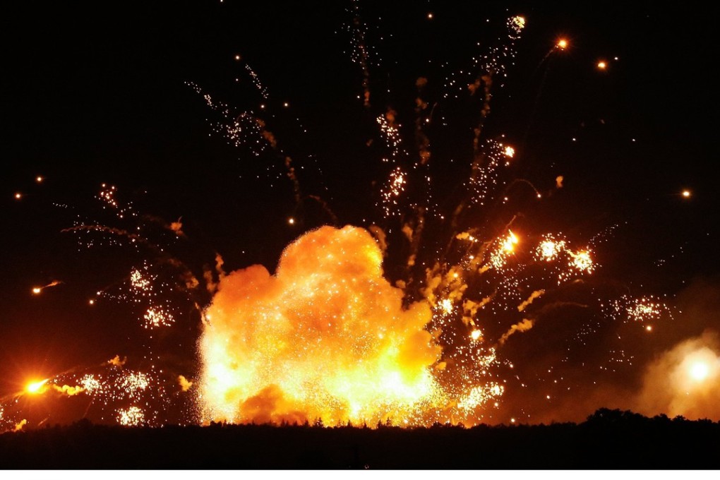 Clouds of smoke and fire billow from explosions at the ammunition depot of the Ukrainian Armed Forces near the city of Kalynivka on Wednesday evening. Photo: EPA