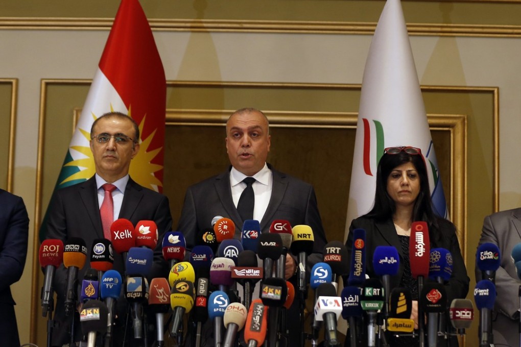 Head of Kurdistan High Electoral Commission Handreen Muhammad Salih announces the results of the independence referendum in Arbil, Kurdistan. The vote, which had a 72 per cent turn out rate, has been condemned by neighbouring nations and prompted airlines to halt flights to the region. Photo: EPA