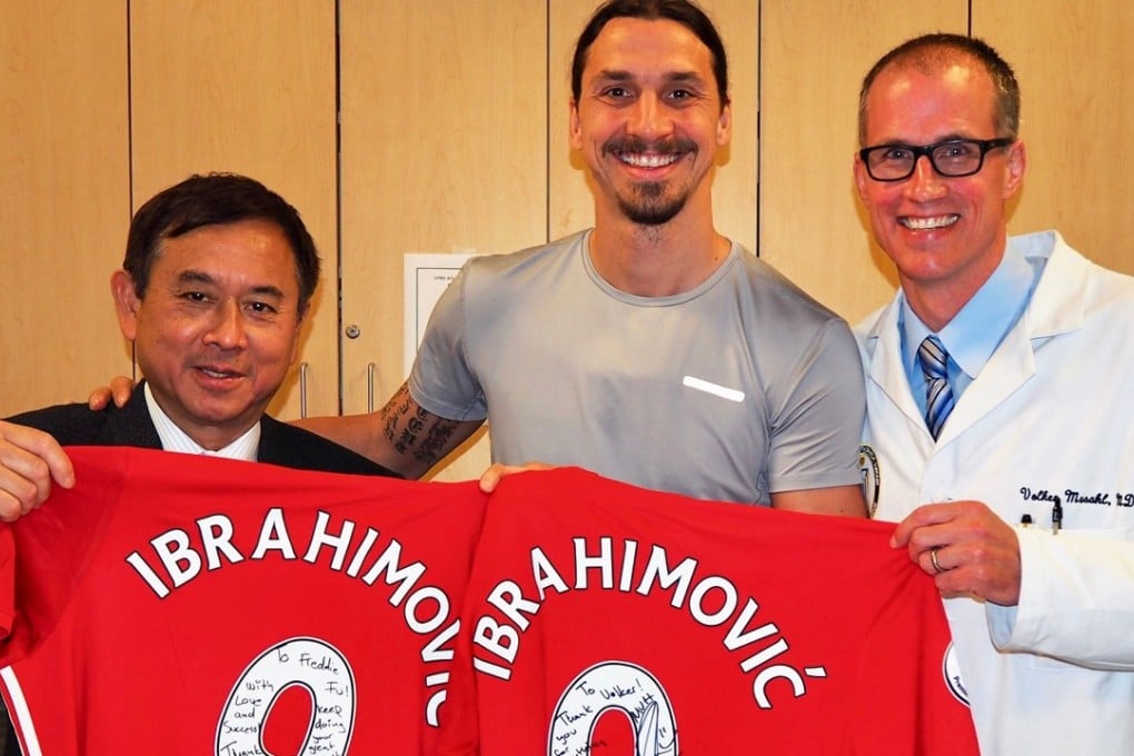 Dr Freddie Fu and colleague Volker Musahl with Zlatan Ibrahimovic. Photo: Freddie Fu
