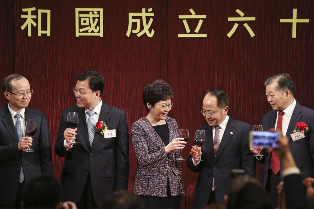 Commissioner of the Ministry of Foreign Affairs of the People's Republic of China in Hong Kong, Xie Feng (left 2); Hong Kong Chief Executive Carrie Lam Cheng Yuet-ngor (left 3); and new Director of the Central Government's Liaison Office, Wang Zhimin (left 4) attend a reception to celebrate the 68th Anniversary of the People's Republic of China at the JW Marriott Hotel in Admiralty. Photo: K.Y. Cheng
