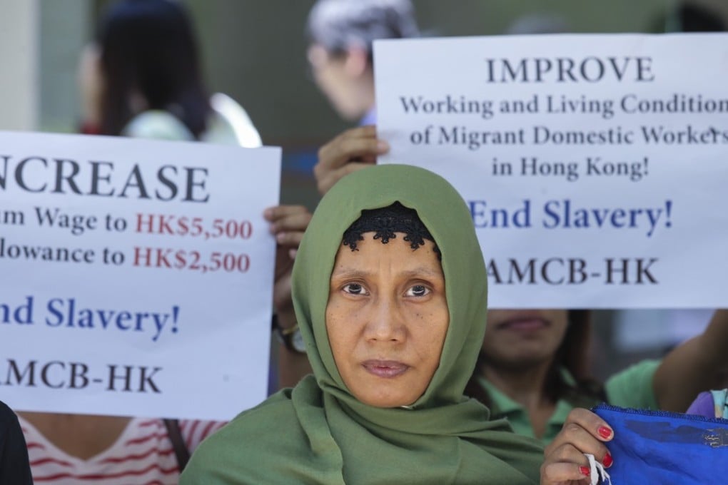 Foreign domestic helpers in Hong Kong stage a rally asking for a pay rise and to meet Labour Department officials, at the Harbour building in Central. Photo: Dickson Lee