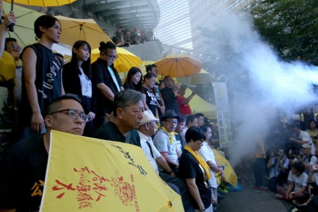 Steam is released at a rally on the third anniversary of the start of the Occupy protests, to commemorate when Tim Mei Avenue was filled with tear gas three years ago. Photo: Sam Tsang