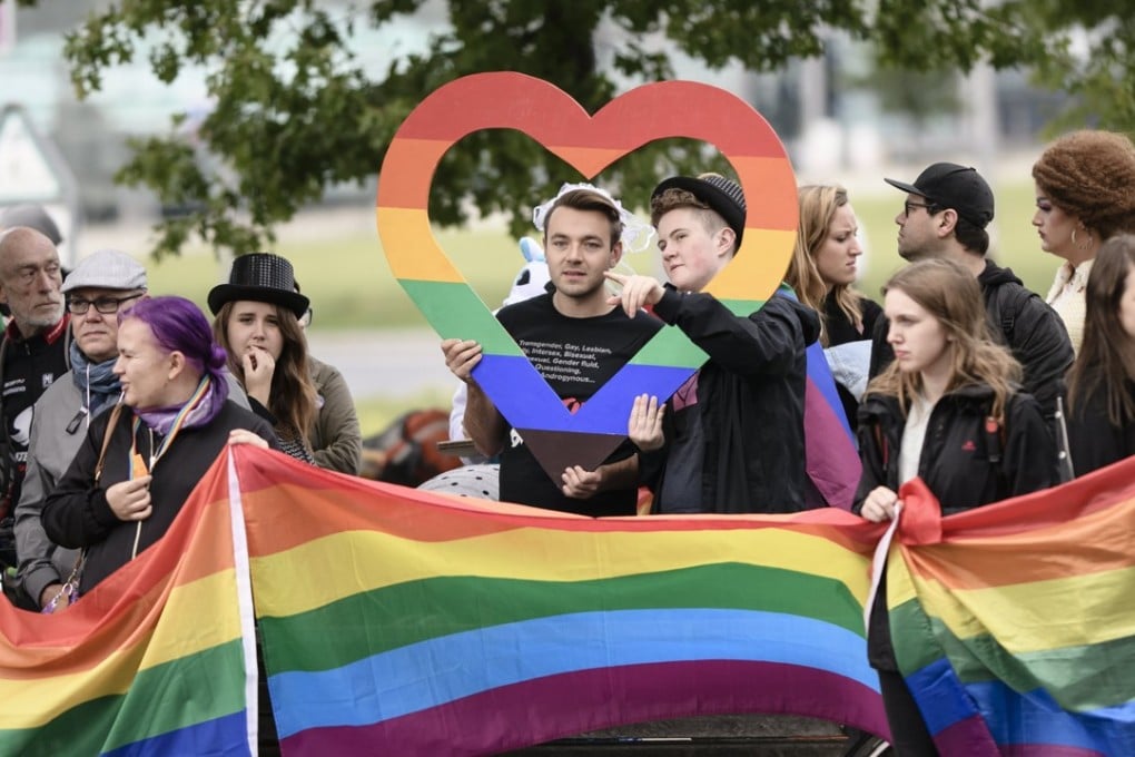 People carry rainbow flags during a counter demonstration against an anti-gay-marriage rally in Berlin on September 15. Photo: EPA