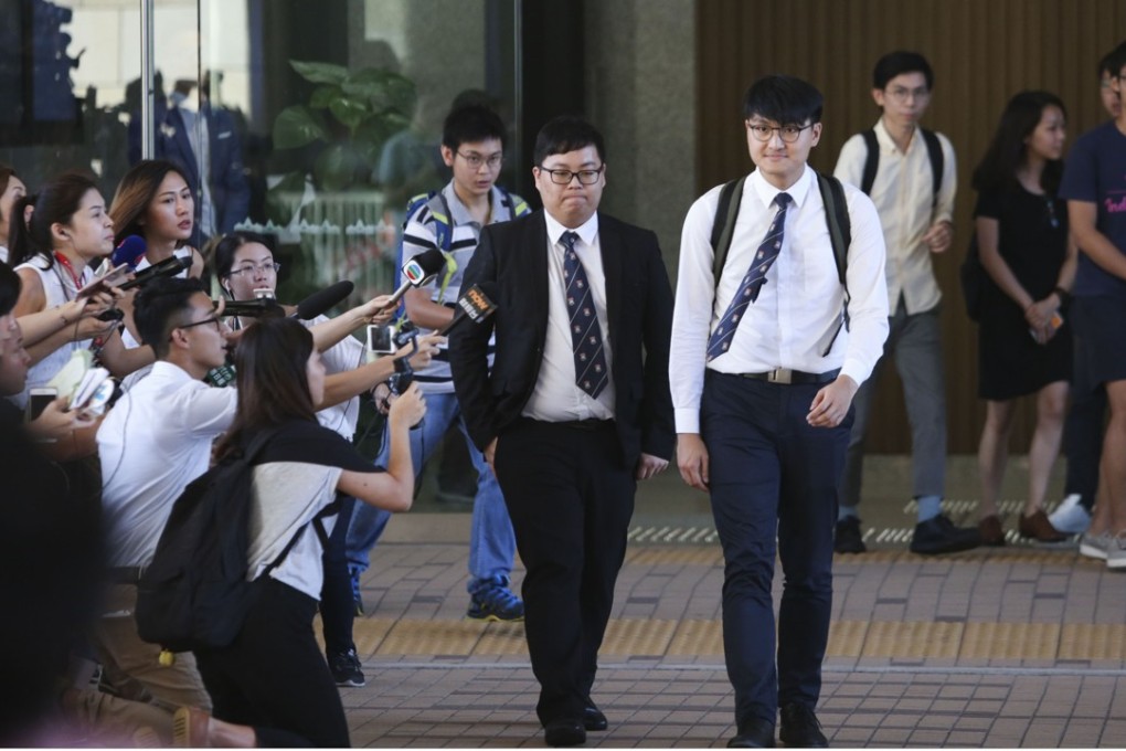 Former student leaders Colman Li Fung-kei (centre left) and Billy Fung Jing-en (centre right) at West Kowloon Court. Photo: Sam Tsang