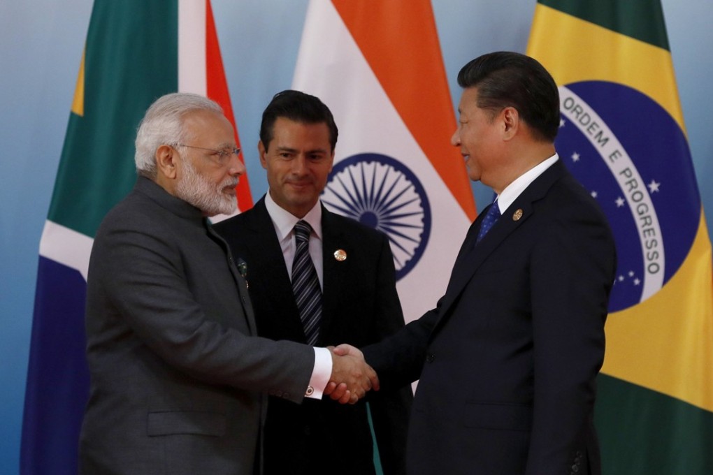 Chinese President Xi Jinping (right) greets Indian Prime Minister Narendra Modi and Mexico's President Enrique Pena Nieto before a group photo session on the sidelines of the 2017 BRICS Summit in Xiamen, China, on September 5. Photo: EPA-EFE