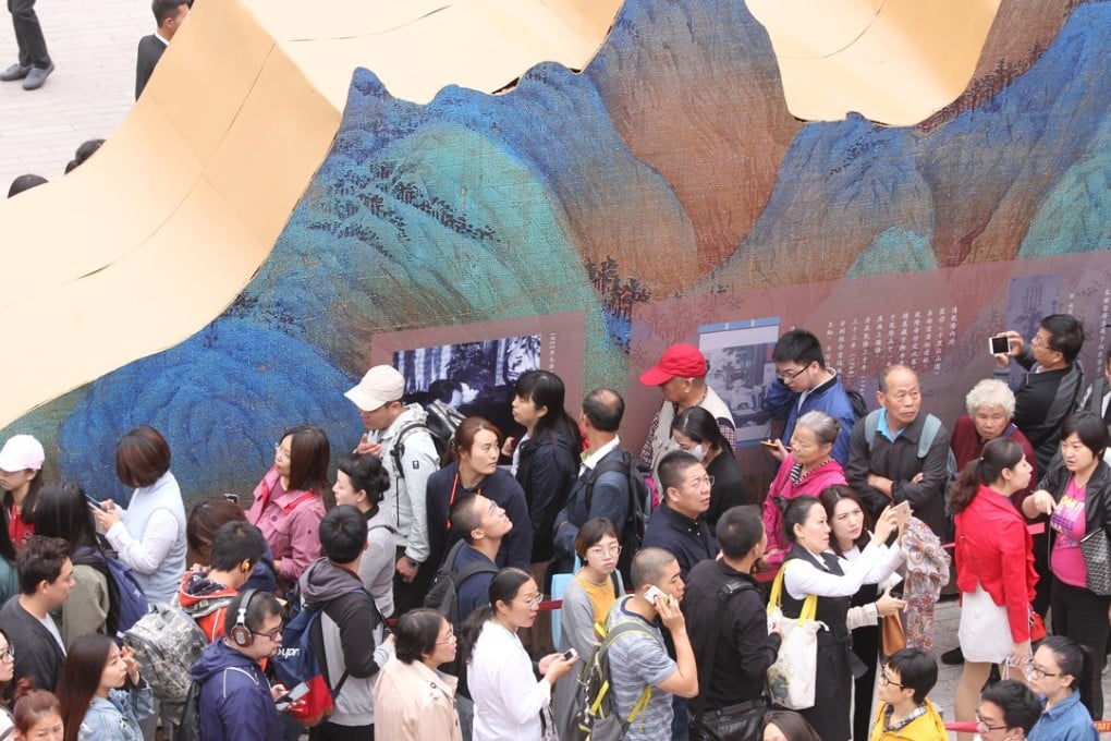 Visitors line up to see “A Panorama of Rivers and Mountains: Blue-Green Landscape Paintings from Across Chinese History” at the Palace Museum in Beijing. Photo: Simon Song