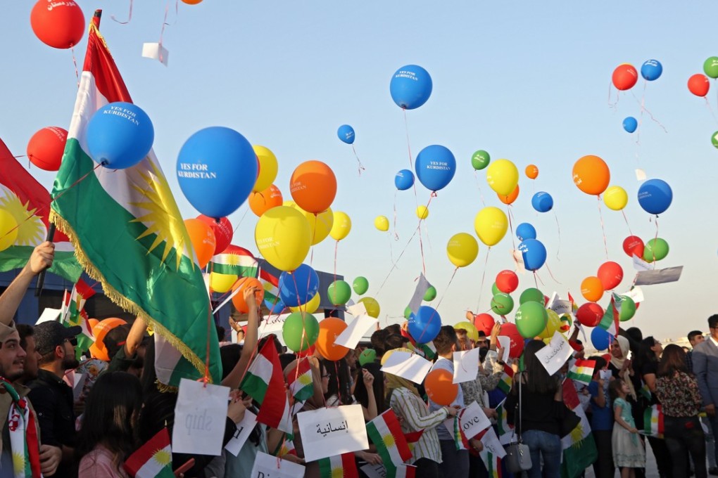People hold balloons in protest of a flight ban at Arbil International Airport. The Iraqi government has imposed a ban on international flights in Iraq's Kurdish region after its non-binding independence referendum which has been strongly rejected by Iraq’s central government, Iran and Turkey. Photo: EPA