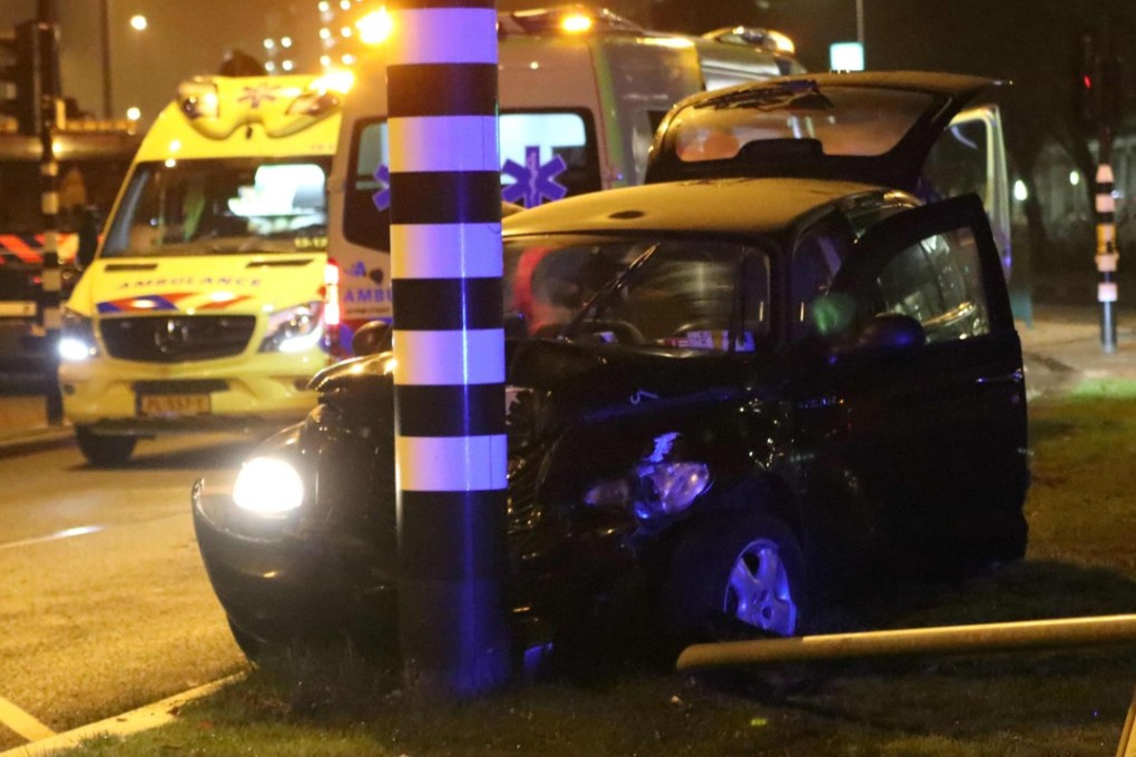Rescuers gather on the scene of a car accident involving Manchester City's Argentine striker Sergio Aguero in Amsterdam. Photo: AFP