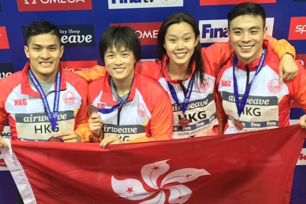 Kenneth To, Sze Hang-yu, Stephanie Au and Kent Cheung Kin-tat celebrate their silver in the 4x50m mixed freestyle relay. Photo: Chan Kin-wa