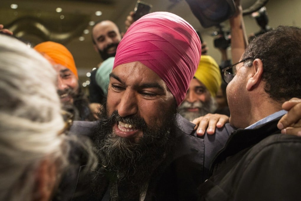 Jagmeet Singh celebrates with supporters after his first-ballot triumph in the contest to lead the leftist New Democratic Party in Toronto on Sunday. Photo: AP