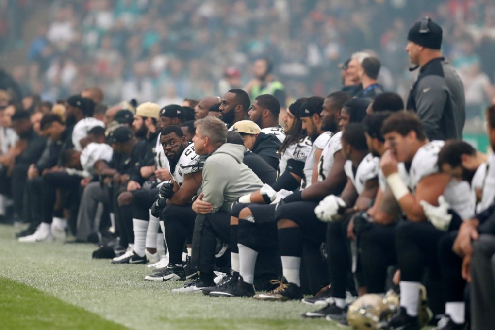 New Orleans Saints players take the knee before the start of the national anthem and their game against the Miami Dolphins at Wembley Stadium. Photo: Reuters