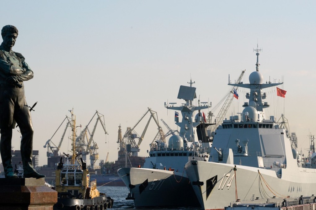 The Hefei Chinese missile destroyer (right) and frigate Yuncheng docked in Saint Petersburg in July. Chinese military ships were part of a naval military parade that took place in Saint Petersburg on Russia's Navy Day on July 30. Photo: AFP