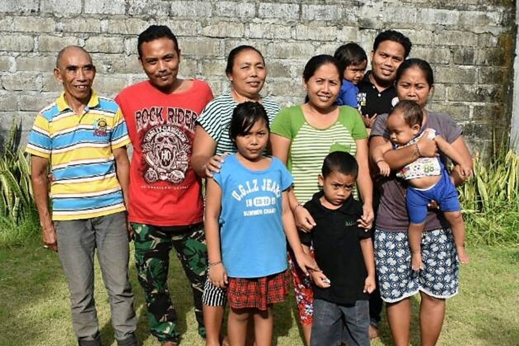 Nyoman Gerti, third from left, 52, and her family have found refuge in Gianyar, approximately 62km from Mount Agung in Bali, Indonesia. Photo: Karim Raslan
