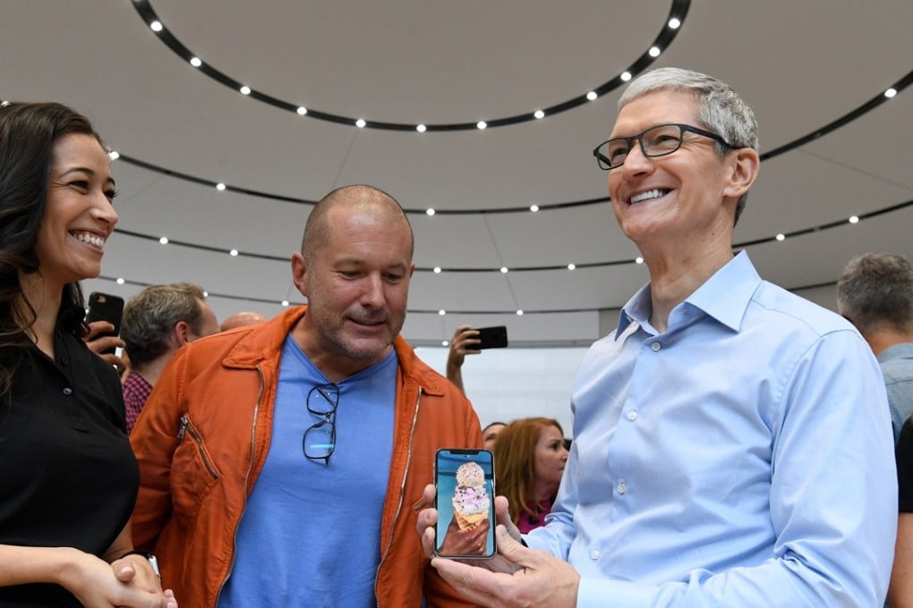 Jony Ive, chief design officer for Apple, (centre) and Tim Cook, chief executive officer of Apple, demonstrate the iPhone X during an event at the Steve Jobs Theater in Cupertino, California. Photo: Bloomberg