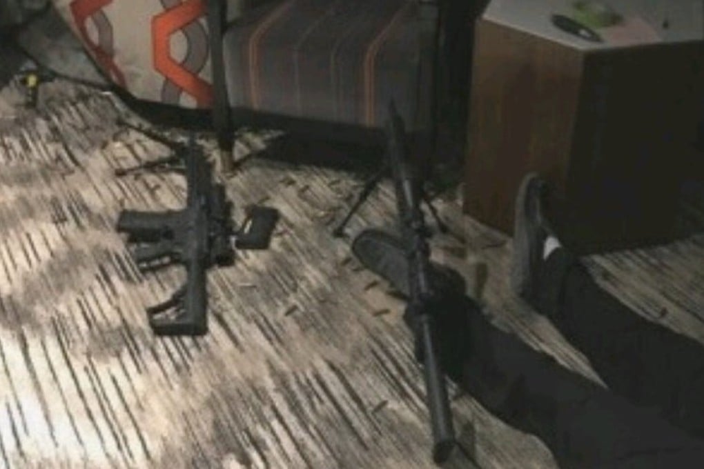 Leaked footage apparently shows the body of Las Vegas gunman Stephen Paddock, inside his Mandalay Bay Resort and Casino room. Guns and bullet casings litter the floor. The images were leaked to US media and widely circulated on social media. Photo: Twitter