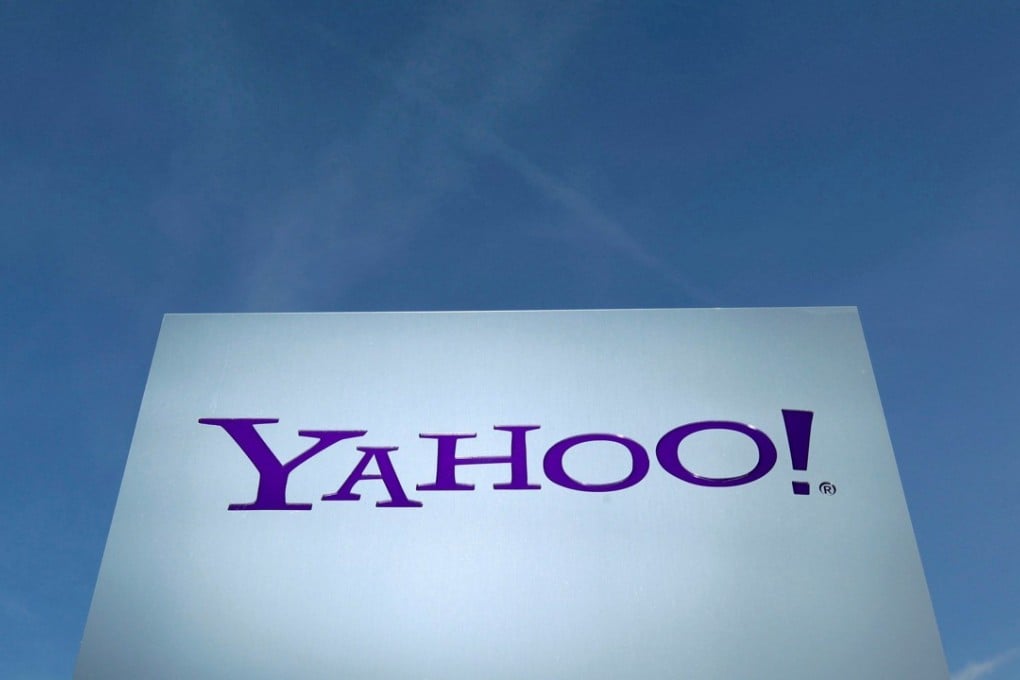 FILE PHOTO - A Yahoo logo is pictured in front of a building in Rolle, Switzerland on December 12, 2012. REUTERS/Denis Balibouse/File Photo