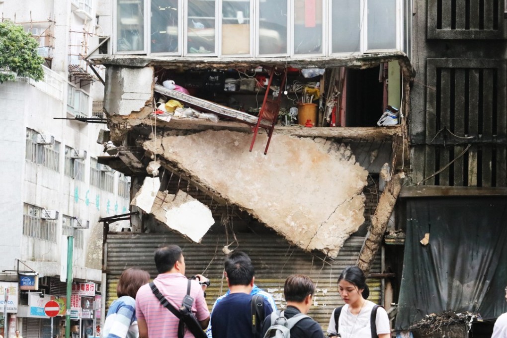 Residents of a Hong Kong tenement building miraculously escaped injury after part of the floor of their flat collapsed on June 21. Photo: Felix Wong