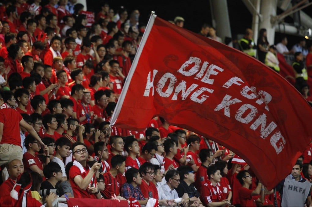A Hong Kong Fan waves a flag at Mong Kok Stadium, scene of regular booing of the China national anthem.. Photo: AFP