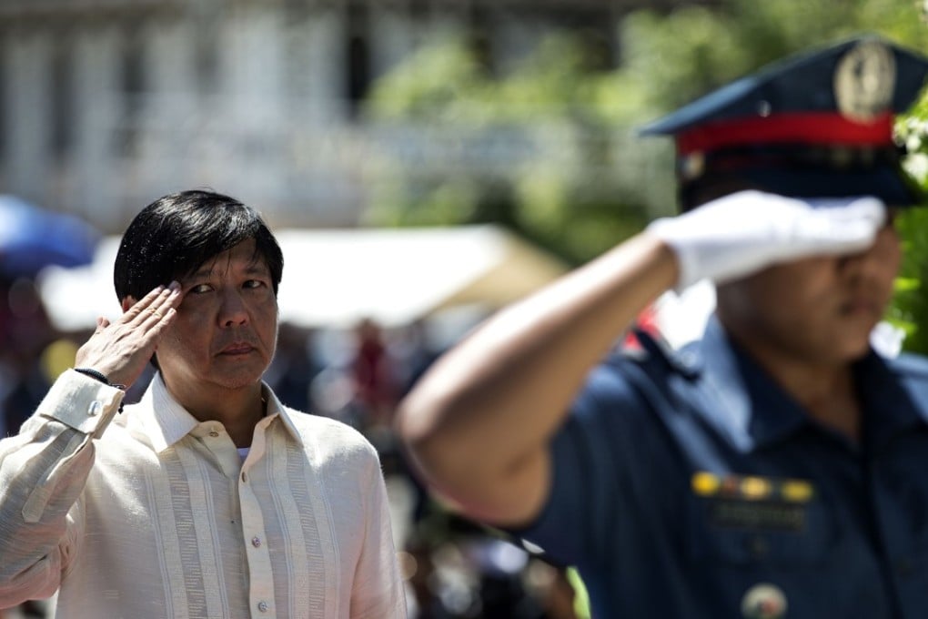 Ferdinand ‘Bongbong’ Marcos Jnr offers a wreath at a monument to his father. Photo: AFP