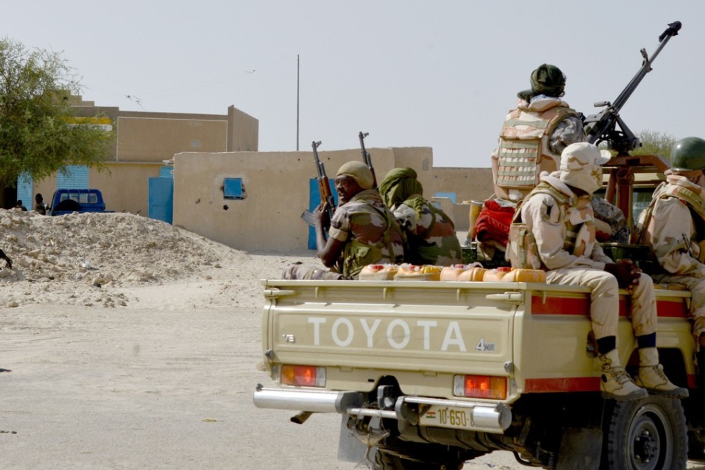 A 2015 file photo shows Nigerien soldiers patrolling on a road between Diffa and Bosso, a region plagued by deadly attacks by Boko Haram insurgents. Photo: AFP