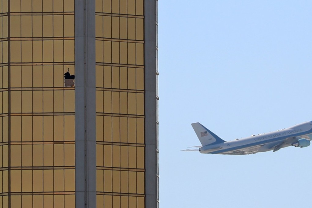Air Force One departs Las Vegas past the broken windows on the Mandalay Bay hotel, where shooter Stephen Paddock conducted his mass shooting along the Las Vegas Strip. Photo: Reuters