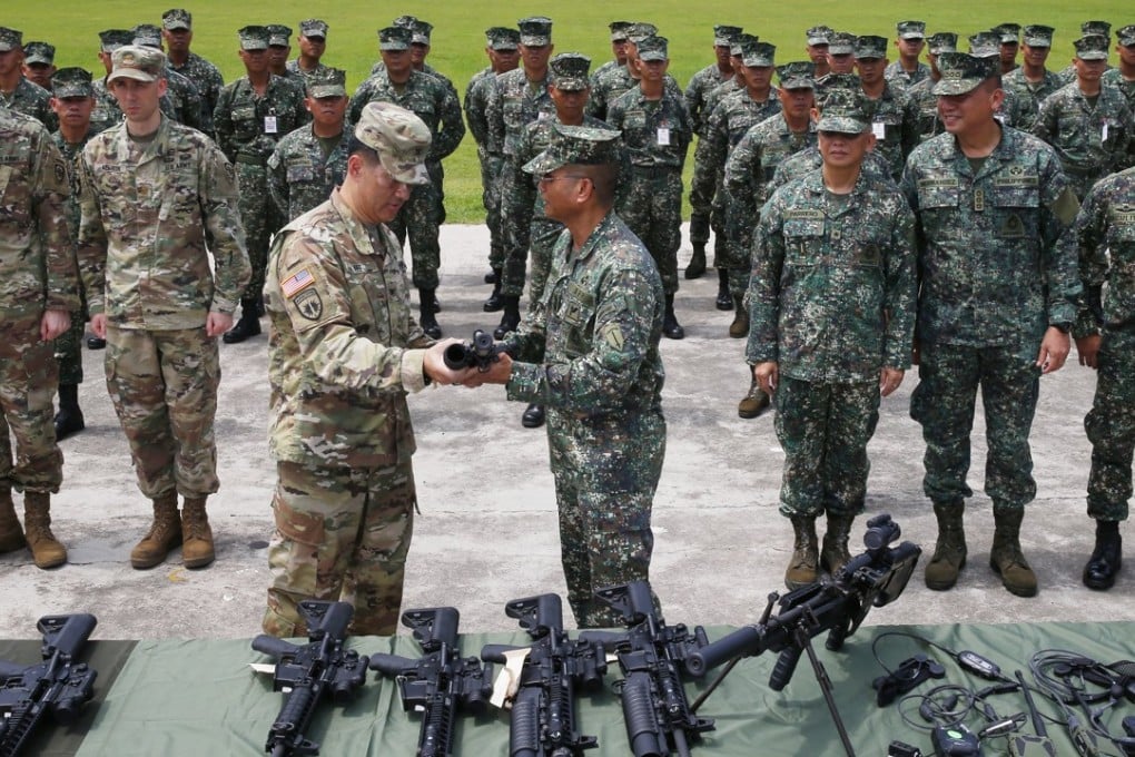 Philippine army general is handed a grenade launcher from the US army as part of America’s help in the fight against Islamic militants in Marawi. The Philippines has hailed the United States as its “number one ally” and announced a return of regular war games, following President Rodrigo Duterte’s call for warmer ties. Photo: AP