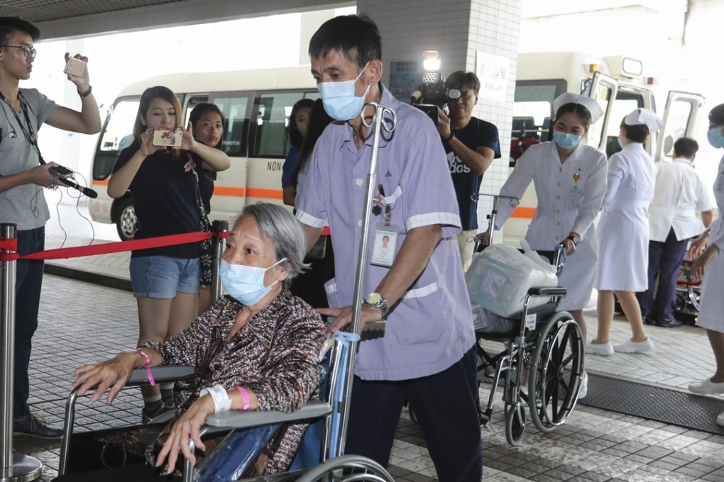 Patients from Queen Elizabeth Hospital are transferred to privately run St. Teresa's Hospital in Kowloon City as part of a plan to ease overcrowding in the public health sector in July. Photo: Edward Wong