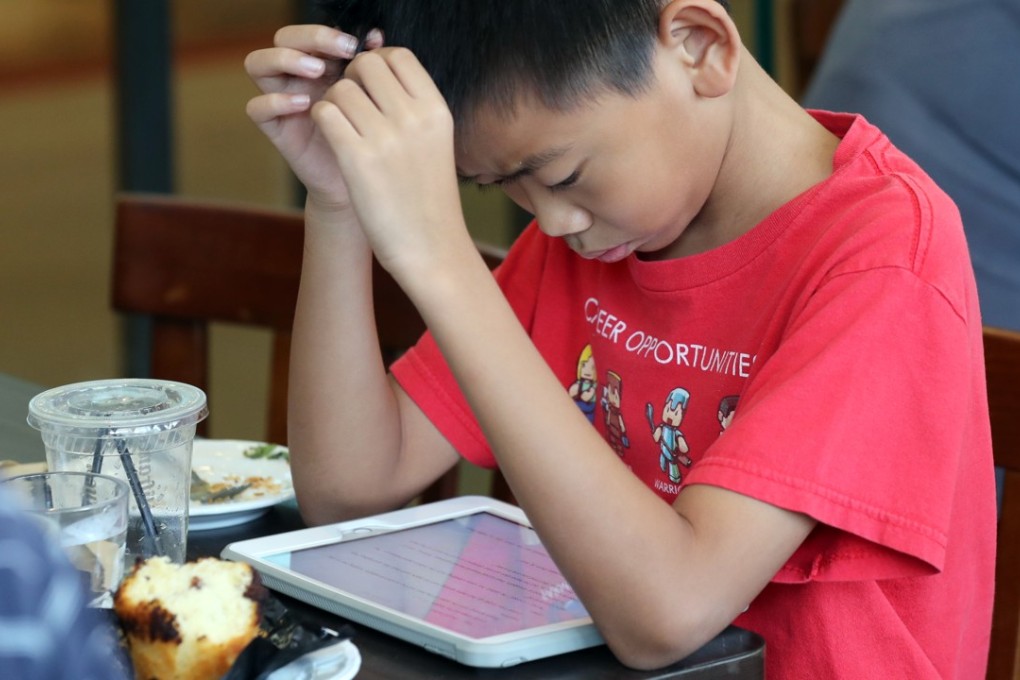 In a study of 7,585 pupils from 51 primary schools conducted in 2016, children between the ages of six and 10 were found to spend an average of four hours a day in their leisure time glued to electronic screens. Photo: Edward Wong