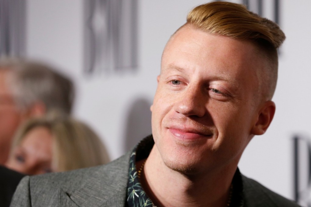 Musician Macklemore performed a gay anthem to more than 80,000 rugby fans in Sydney, Australia, as the North Queensland Cowboys took on the Melbourne Storm in the National Rugby League Grand Final. Photo: Reuters